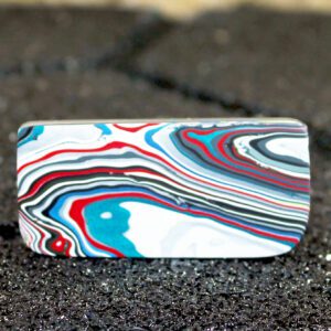Rectangular marbled tile with red and blue swirls