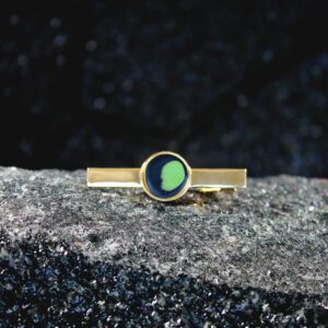 Gold tie clip with green enamel crescent