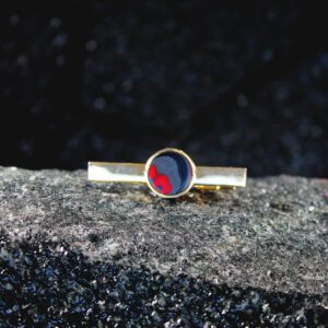 Gold tie clip with red-blue enamel disc