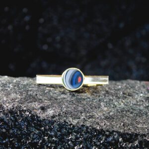 Gold tie bar with blue and red enamel