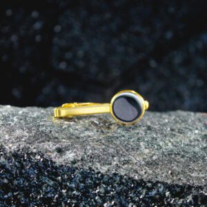 Gold tie clip with black round enamel