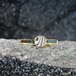 Gold tie clip with multicolored swirl center