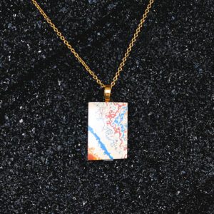 Gold chain necklace with abstract rectangular pendant