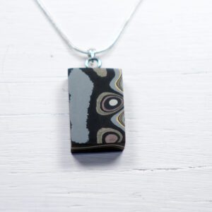 Rectangular patterned pendant on silver chain