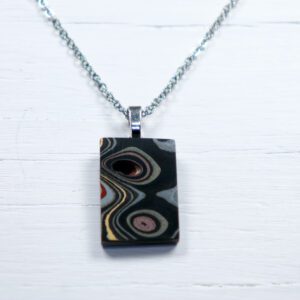 Rectangular swirled pendant on silver chain