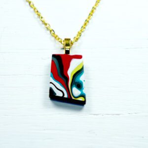 Gold chain necklace with multicolored abstract pendant