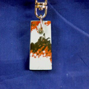 Rectangular enamel keychain with orange-black pattern