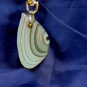 Concentric striped teardrop pendant on navy fabric