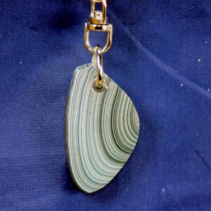 Striped pendant keychain on blue fabric