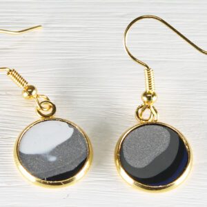 Gold round dangle earrings with gray inlays