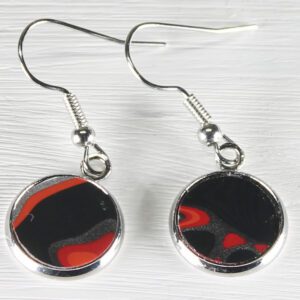 Pair of round black and red dangle earrings