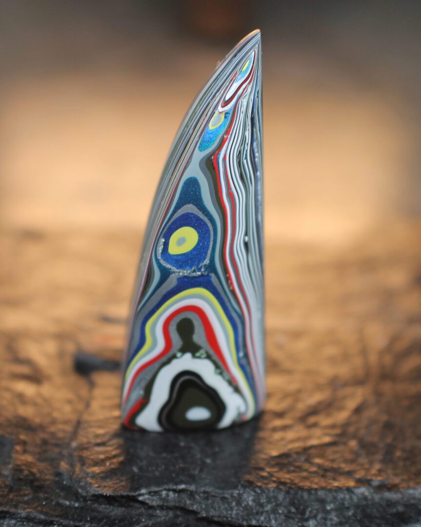Finished Piece of Fordite - 41.51mm x 14.35mm x 8.8mm (F-042)